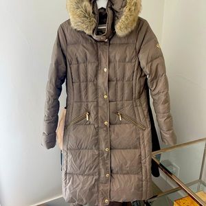 Beautiful Michael Kors down puffer jacket and a size 6. Gorgeous neutral color!